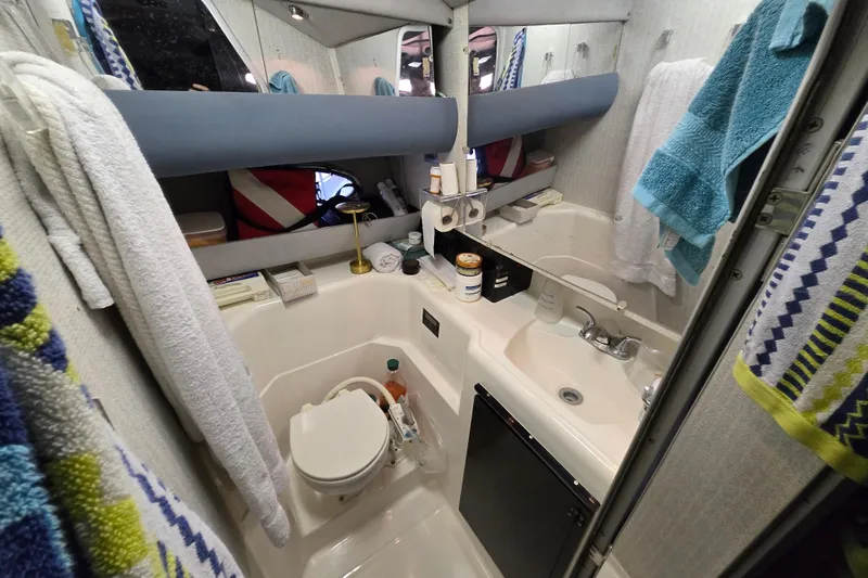 Slide: The Image of Control panel of a 1988 Bayliner 3450 Avanti boat with various switches and gauges. - 21