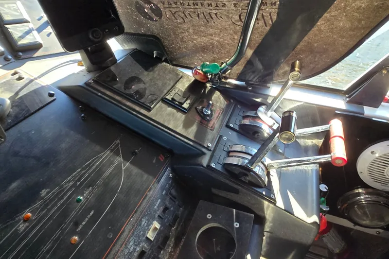 Slide: The Image of Cockpit of 1988 Bayliner 3450 Avanti with Garmin navigation system and steering wheel. - 34