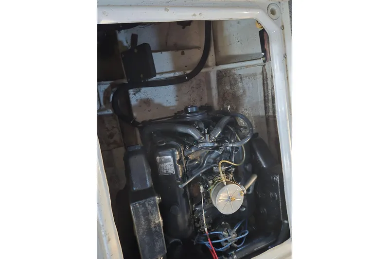 Slide: The Image of 1988 Bayliner 3450 Avanti engine compartment, showcasing mechanical components and layout. - 45