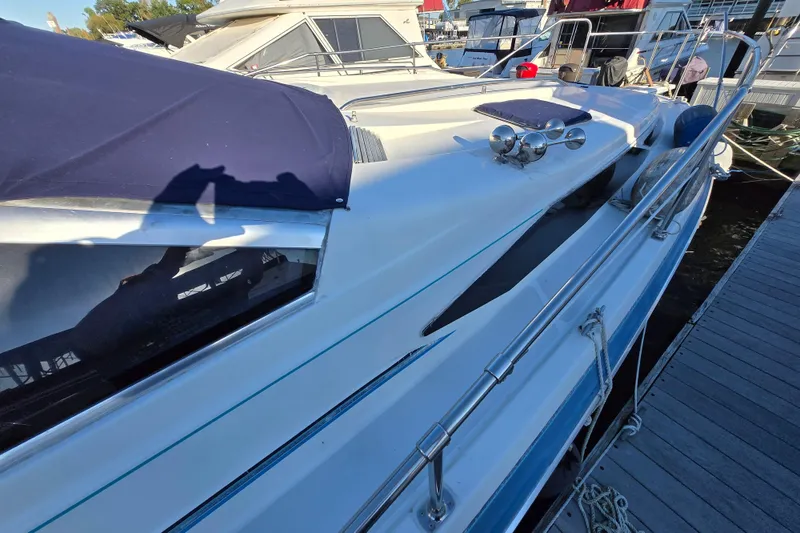 Slide: The Image of Engine compartment of a 1988 Bayliner 3450 Avanti boat, showcasing mechanical components. - 46