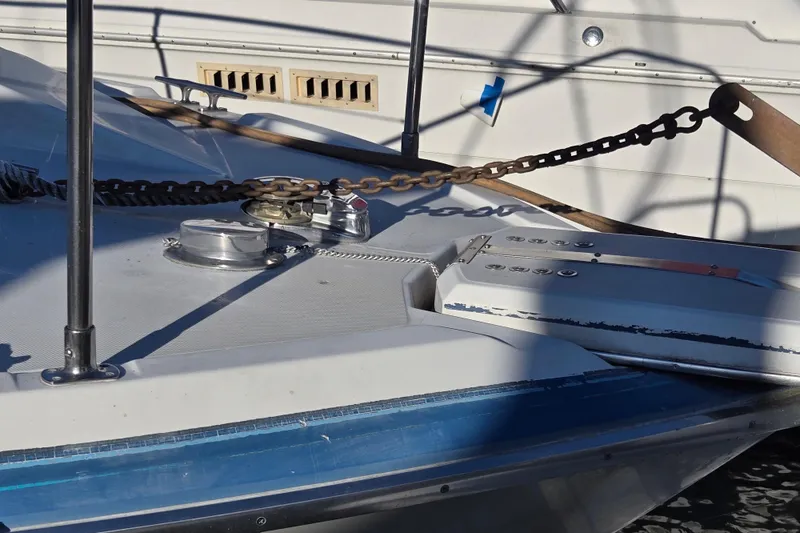 Slide: The Image of Engine compartment of a 1988 Bayliner 3450 Avanti boat, showing mechanical components. - 47