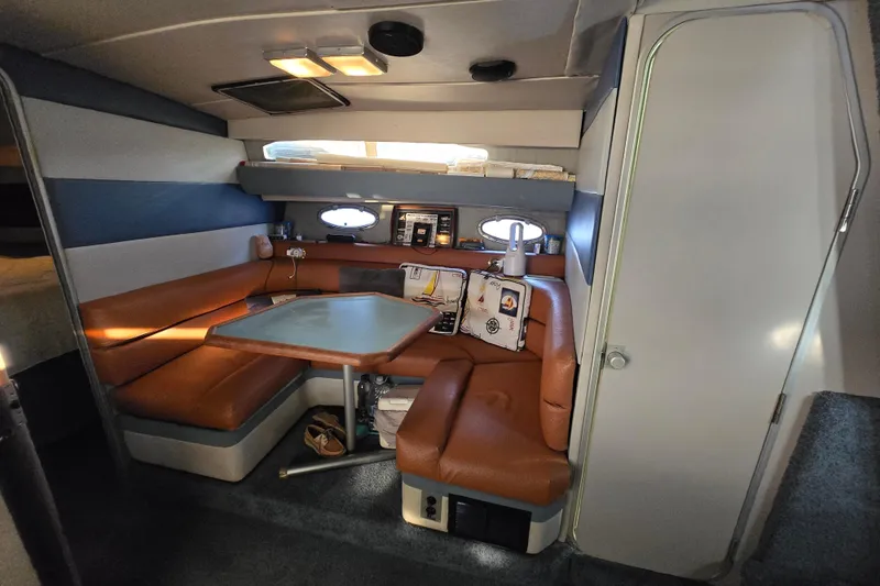 Slide: The Image of 1988 Bayliner 3450 Avanti docked, featuring sleek design and white exterior. - 6