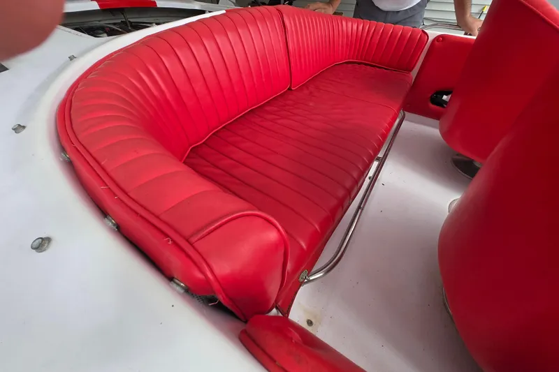 Slide: The Image of Red leather seating in a 2005 Donzi 16 Classic boat interior. - 3