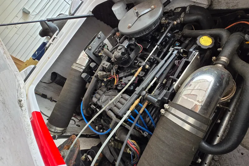 Slide: The Image of Engine of a 2005 Donzi 16 Classic boat, showcasing intricate mechanical components. - 4