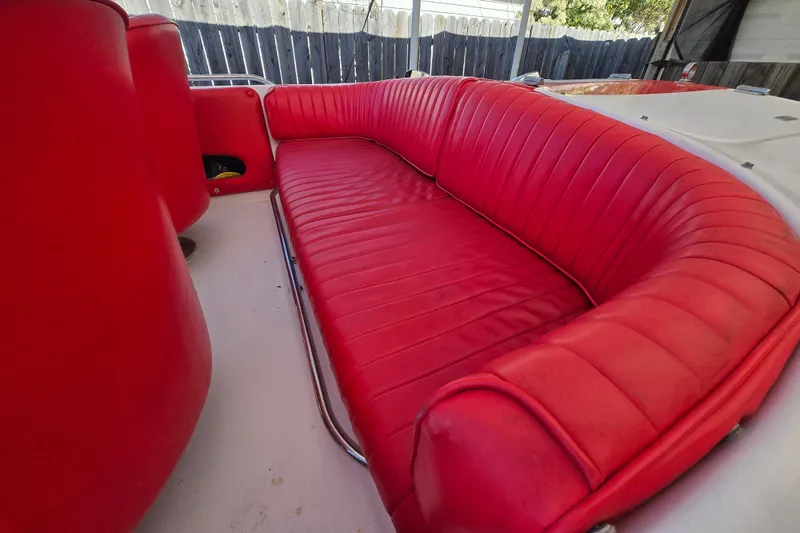 Slide: The Image of Red leather seating in a 2005 Donzi 16 Classic boat interior. - 7