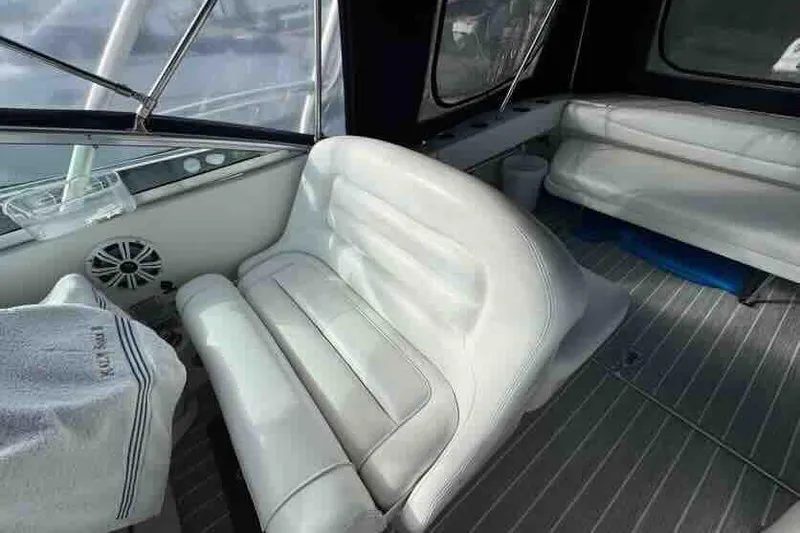 Slide: The Image of Interior of 2005 Sea Ray 290 Amberjack with white seating and marine features. - 11