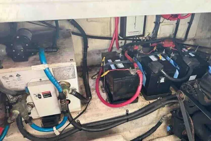 Slide: The Image of Engine compartment of a 2005 Sea Ray 290 Amberjack with batteries and wiring. - 28