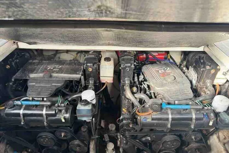 Slide: The Image of Engine compartment of a 2005 Sea Ray 290 Amberjack boat, featuring dual engines. - 29