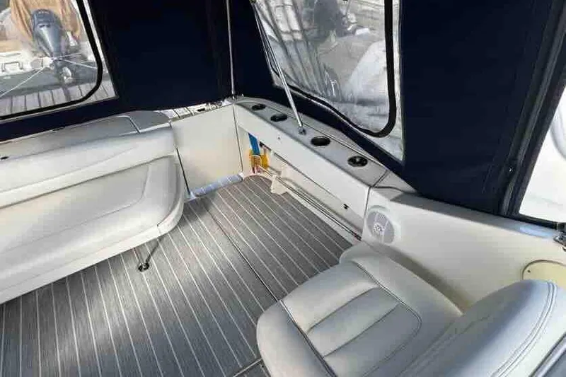 Slide: The Image of Interior of 2005 Sea Ray 290 Amberjack boat with seating and windows. - 8