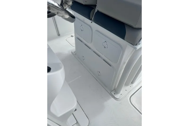 Slide: The Image of 2025 Hurricane Center Console 24 OB interior with storage compartments and seating. - 10