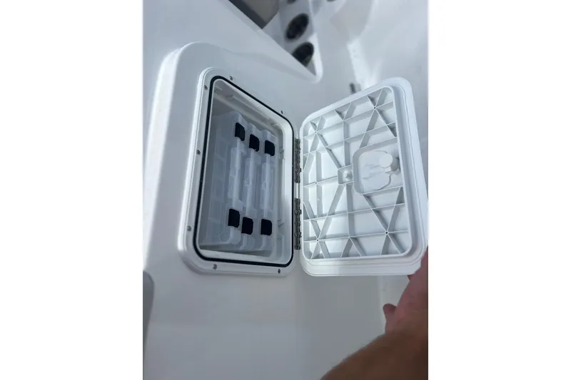 Slide: The Image of Open storage compartment on 2025 Hurricane Center Console 24 OB boat. - 11