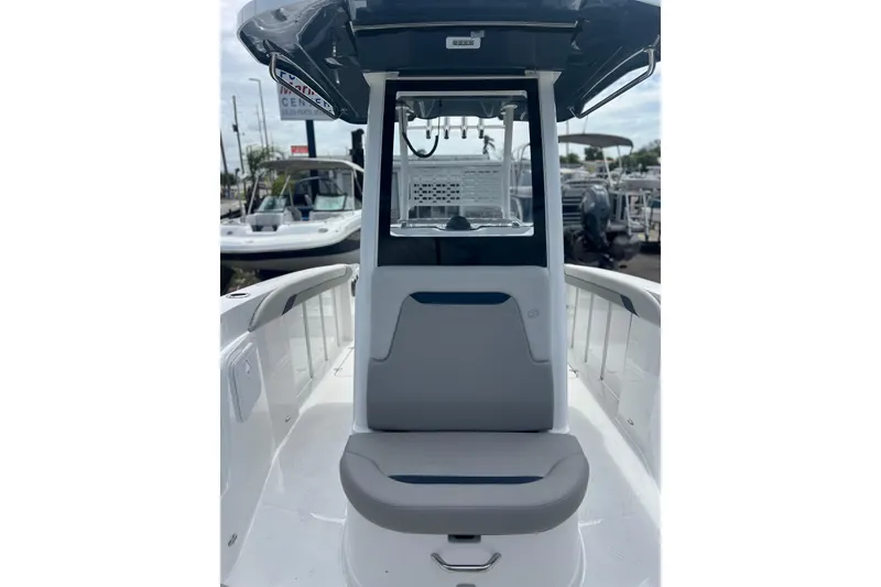 Slide: The Image of 2025 Hurricane Center Console 24 OB boat interior with seating and console view. - 12