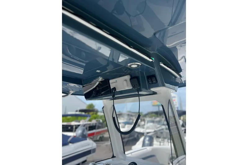 Slide: The Image of 2025 Hurricane Center Console 24 OB boat interior with Garmin equipment and sleek design. - 13