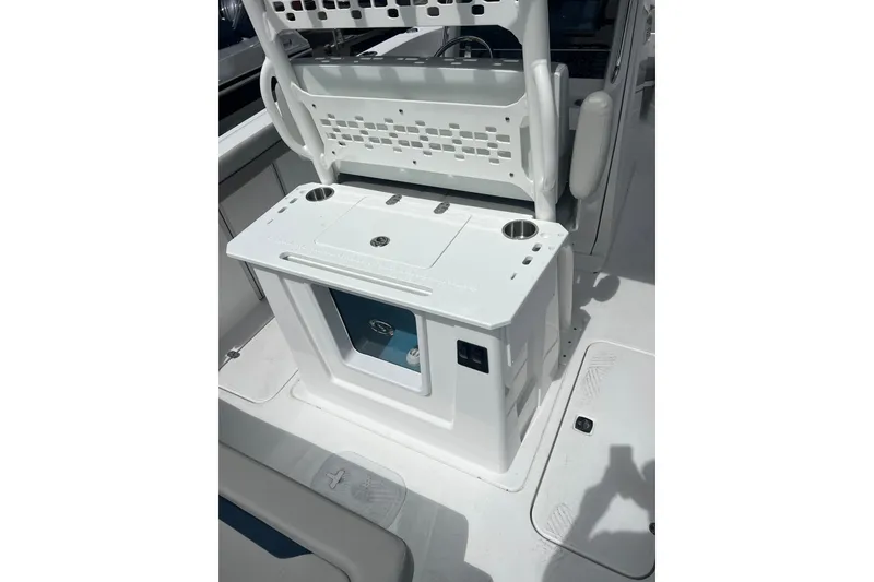 Slide: The Image of 2025 Hurricane Center Console 24 OB boat interior with storage and cup holders. - 16