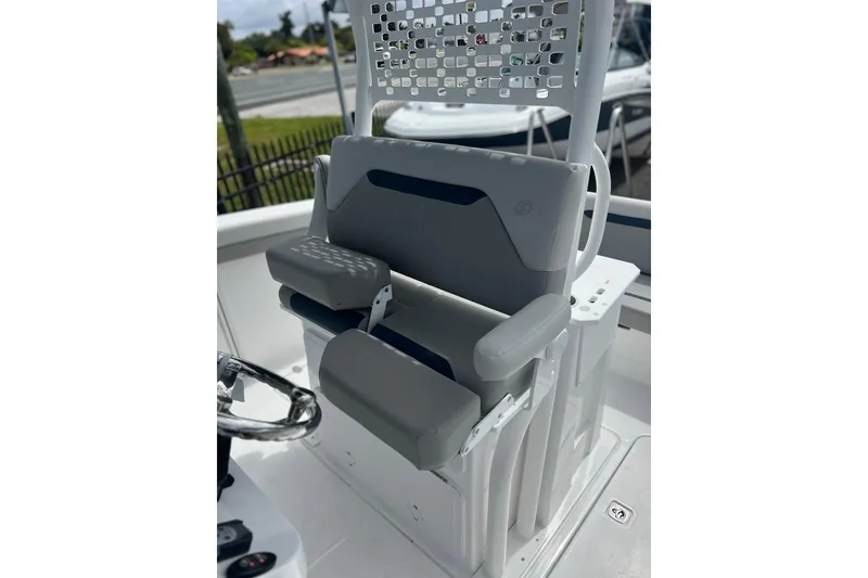 Slide: The Image of 2025 Hurricane Center Console 24 OB boat seat with armrests and modern design. - 18