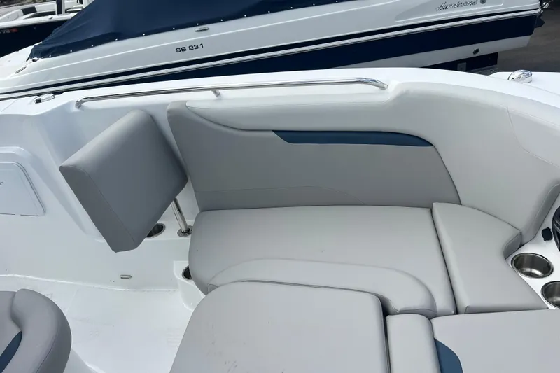 Slide: The Image of 2025 Hurricane Center Console 24 OB boat seating area with gray upholstery and cup holders. - 20