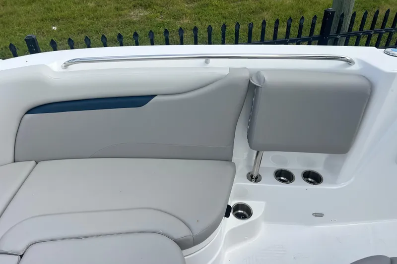Slide: The Image of 2025 Hurricane Center Console 24 OB boat interior with gray seating and cup holders. - 21