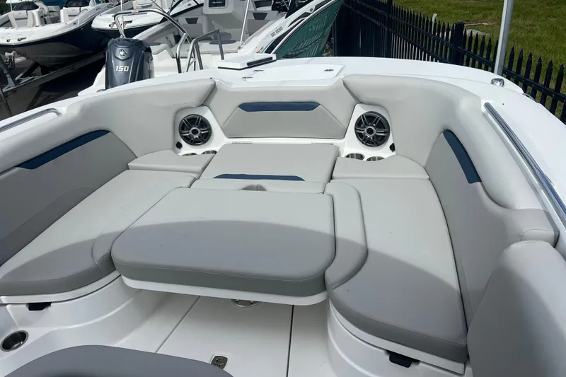 Slide: The Image of 2025 Hurricane Center Console 24 OB boat interior with cushioned seating and built-in speakers. - 23