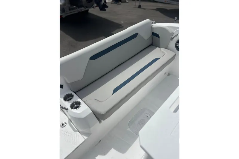 Slide: The Image of 2025 Hurricane Center Console 24 OB boat interior with cushioned seating and cup holders. - 24