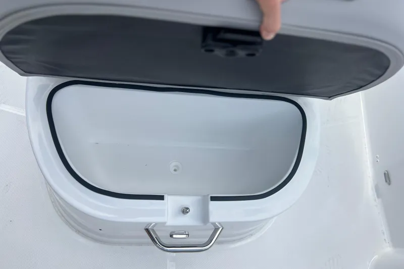 Slide: The Image of Open storage compartment on 2025 Hurricane Center Console 24 OB boat. - 27