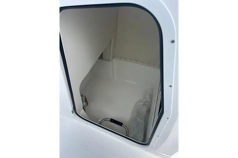 Slide: The Image of 2025 Hurricane Center Console 24 OB storage compartment interior view. - 28