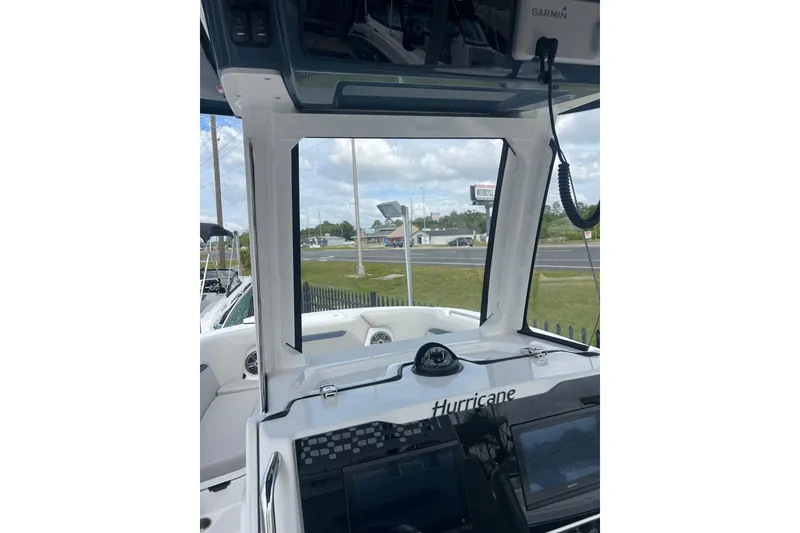 Slide: The Image of 2025 Hurricane Center Console 24 OB boat interior with navigation equipment and open view. - 5