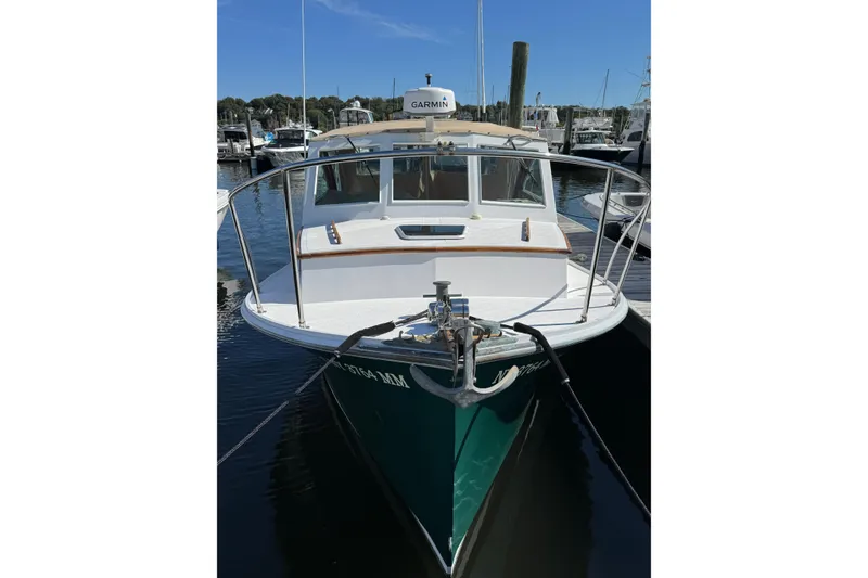 Slide: The Image of 1997 Webbers Cove PB 26 boat docked at marina, front view with Garmin equipment. - 2