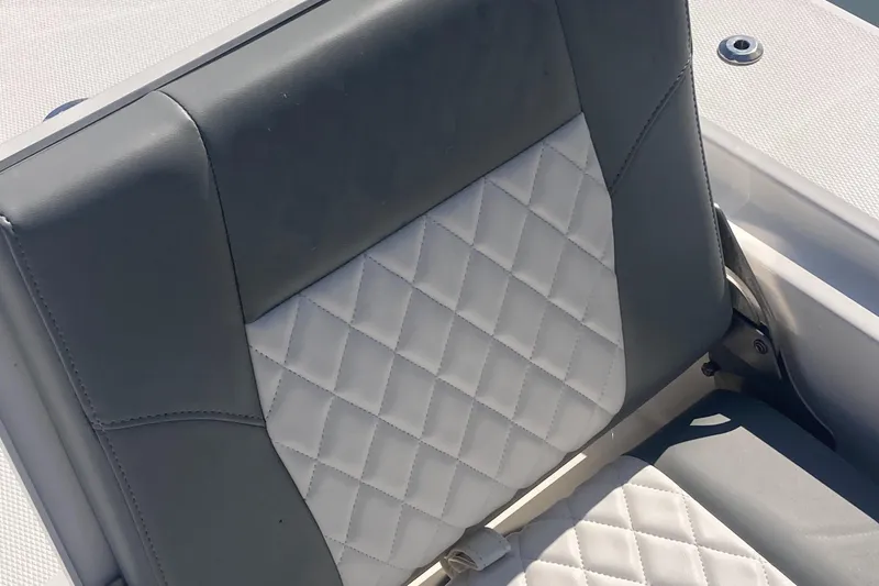Slide: The Image of 2024 Regulator 30XO boat seat with diamond-stitched upholstery, gray and white design. - 18