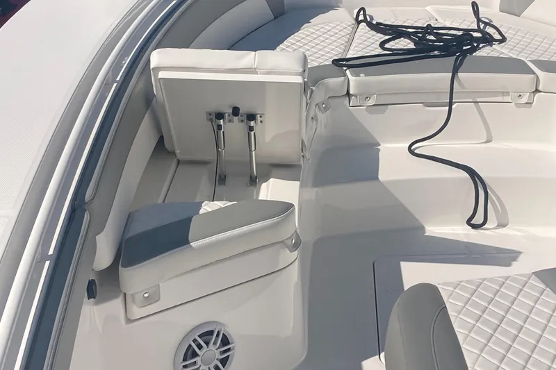Slide: The Image of 2024 Regulator 30XO boat interior with cushioned seating and coiled rope. - 20