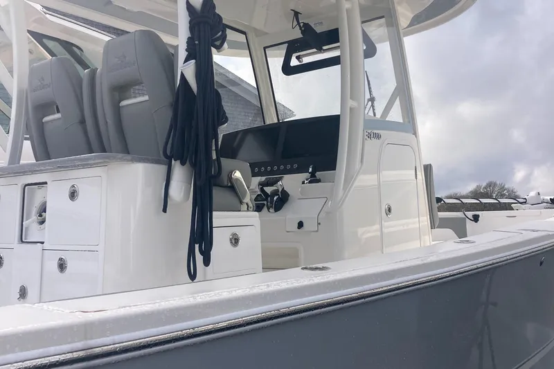 Slide: The Image of 2024 Regulator 30XO boat interior with helm and seating, showcasing modern design. - 6