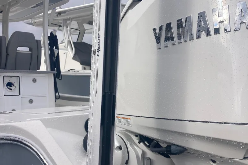 Slide: The Image of 2024 Regulator 30XO boat with Yamaha engine, showcasing sleek design and modern features. - 9