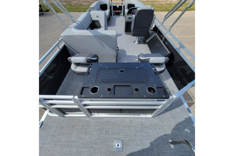 Slide: The Image of 2026 Sun Tracker SportFish 22 DLX pontoon boat interior with seating and fishing station. - 3