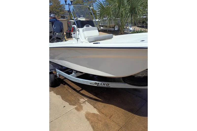 Slide: The Image of 2026 Mako Pro Skiff 13 CC boat on trailer, parked outdoors. - 50