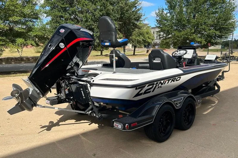 Slide: The Image of 2026 Nitro Z21 XL Pro boat with powerful outboard motor, parked on a trailer. - 81