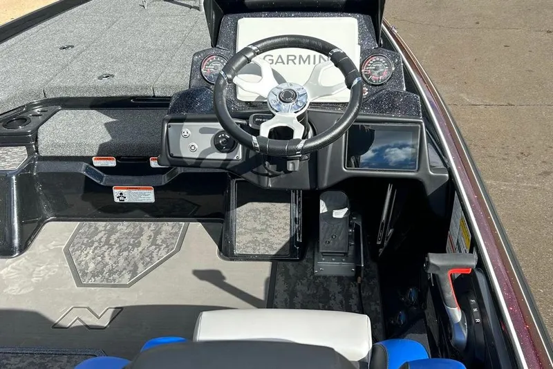 Slide: The Image of 2026 Nitro Z21 XL Pro boat cockpit with Garmin navigation and modern controls. - 83