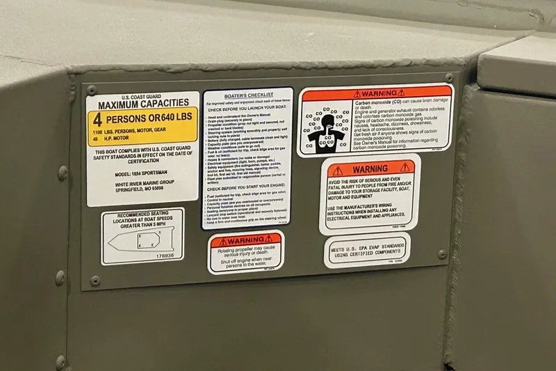 Slide: The Image of 2026 Tracker Grizzly 10 Jon boat on trailer in parking lot. - 2