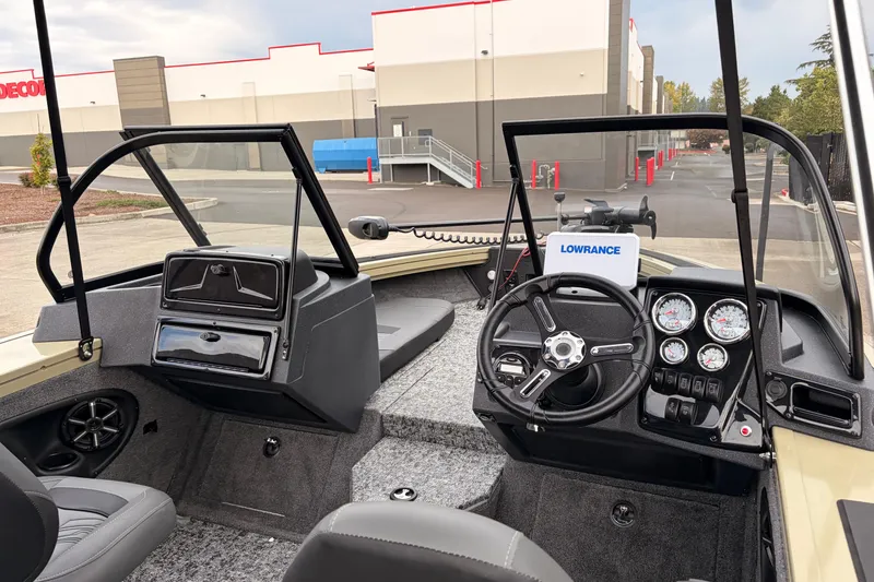 Slide: The Image of 2026 Tracker Targa V-19 Combo boat interior with swivel seat and dual windshields. - 12