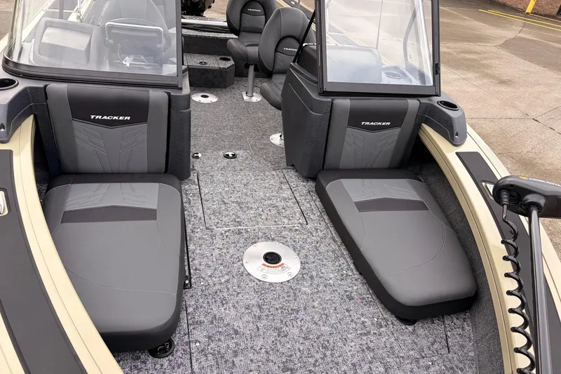 Slide: The Image of 2026 Tracker Targa V-19 Combo boat interior with gray seating and carpeted flooring. - 14
