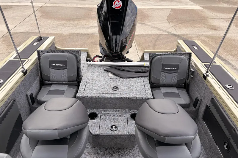 Slide: The Image of 2026 Tracker Targa V-19 Combo boat storage compartment with gear inside. - 15