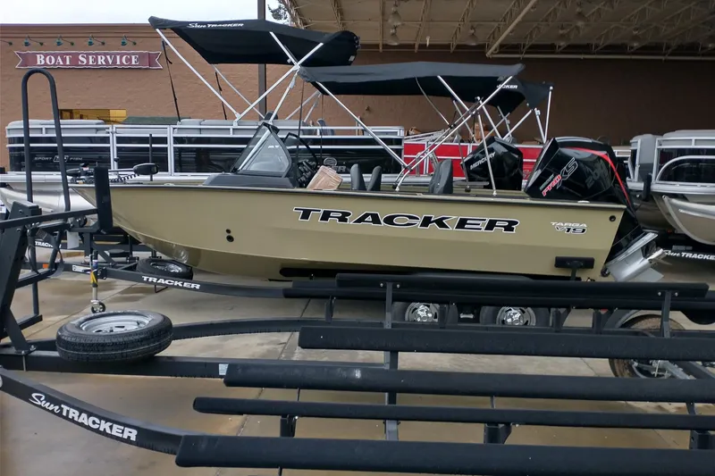 Slide: The Image of 2026 Tracker Targa V-19 Combo boat on trailer at service center. - 4