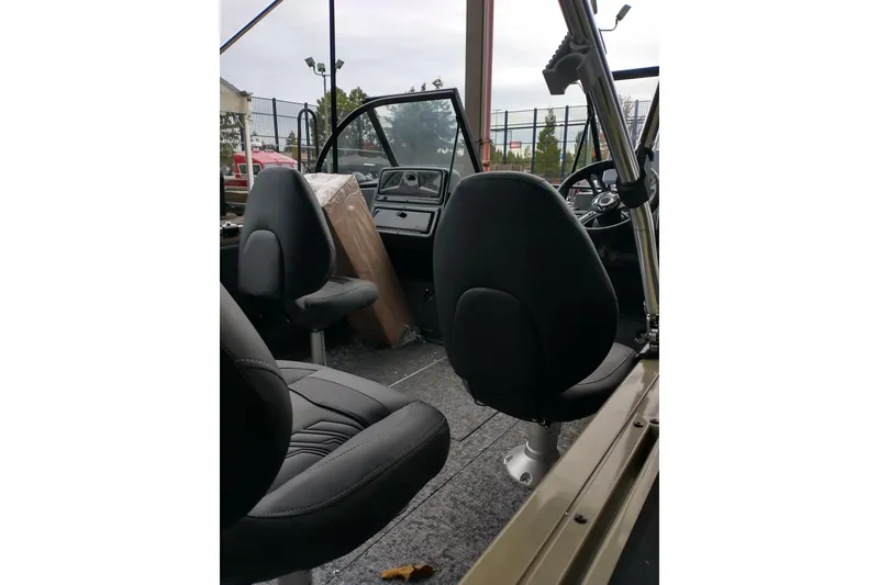 Slide: The Image of Interior of 2026 Tracker Targa V-19 Combo boat with seating and dashboard. - 8