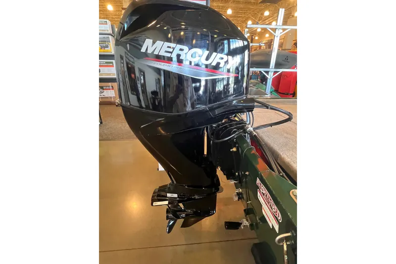 Slide: The Image of 2026 Tracker Bass Tracker Classic Limited with Mercury outboard motor in showroom. - 4
