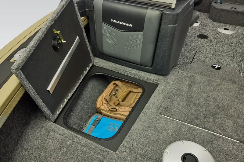 Slide: The Image of 2026 Tracker Targa V-19 Combo boat interior with green navigation light and water bottle. - 15