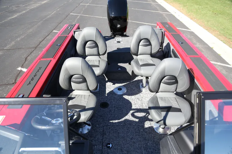Slide: The Image of 2026 Tracker Targa V-19 Combo boat interior with four seats and steering console. - 4
