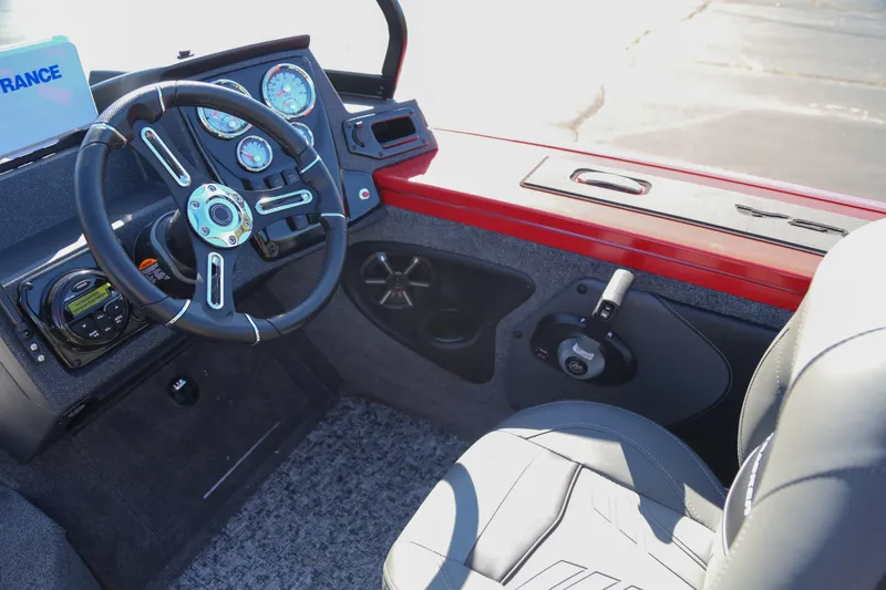 Slide: The Image of Interior of 2026 Tracker Targa V-19 Combo boat with steering wheel and dashboard controls. - 5