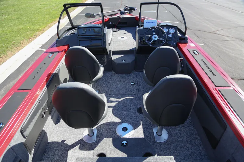 Slide: The Image of 2026 Tracker Targa V-19 Combo boat interior with gray seats and motor. - 6
