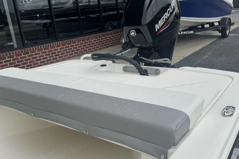 Slide: The Image of 2026 Mako Pro Skiff 13 CC with Mercury engine, parked outdoors. - 52