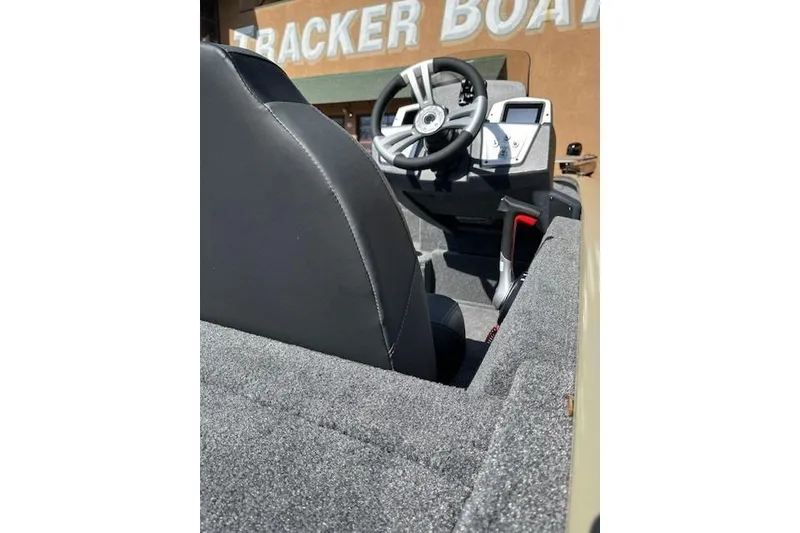 Slide: The Image of Interior view of 2026 Tracker Pro Team 195 boat, featuring steering wheel and dashboard. - 56