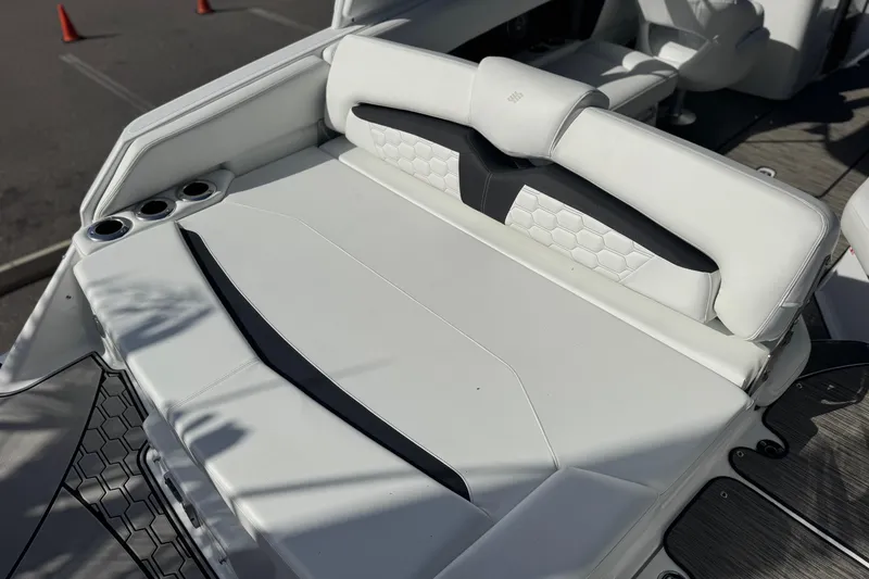 Slide: The Image of 2026 Four Winns HD8 OB boat with white cushioned seating and cup holders. - 19