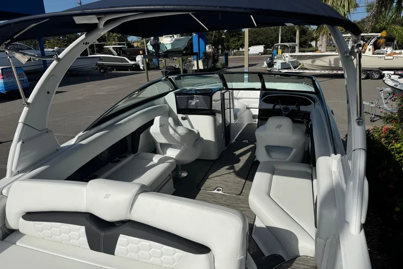 Slide: The Image of 2026 Four Winns HD8 OB boat interior with white seating and modern design. - 20